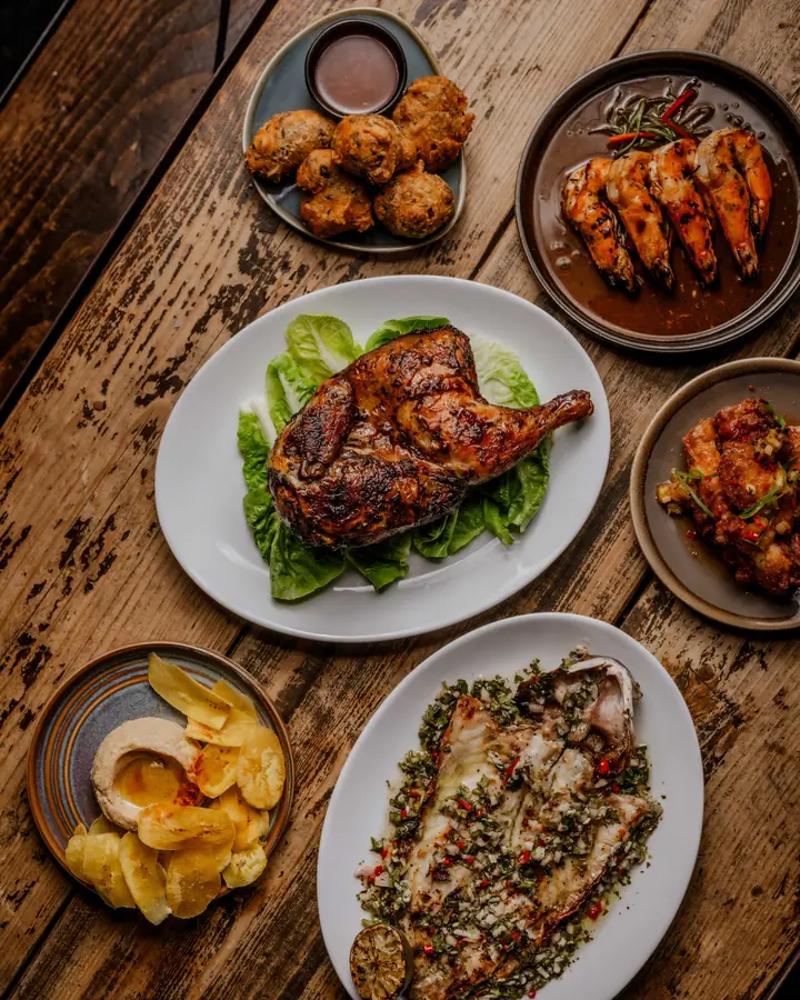 A table of Likkle Bit sharing plates